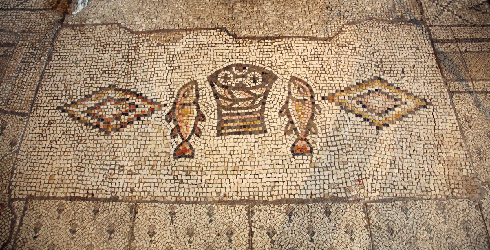 Mosaic found in Church of the Multiplication in Israel. There is a replica in the chapel at Loaves & Fishes.